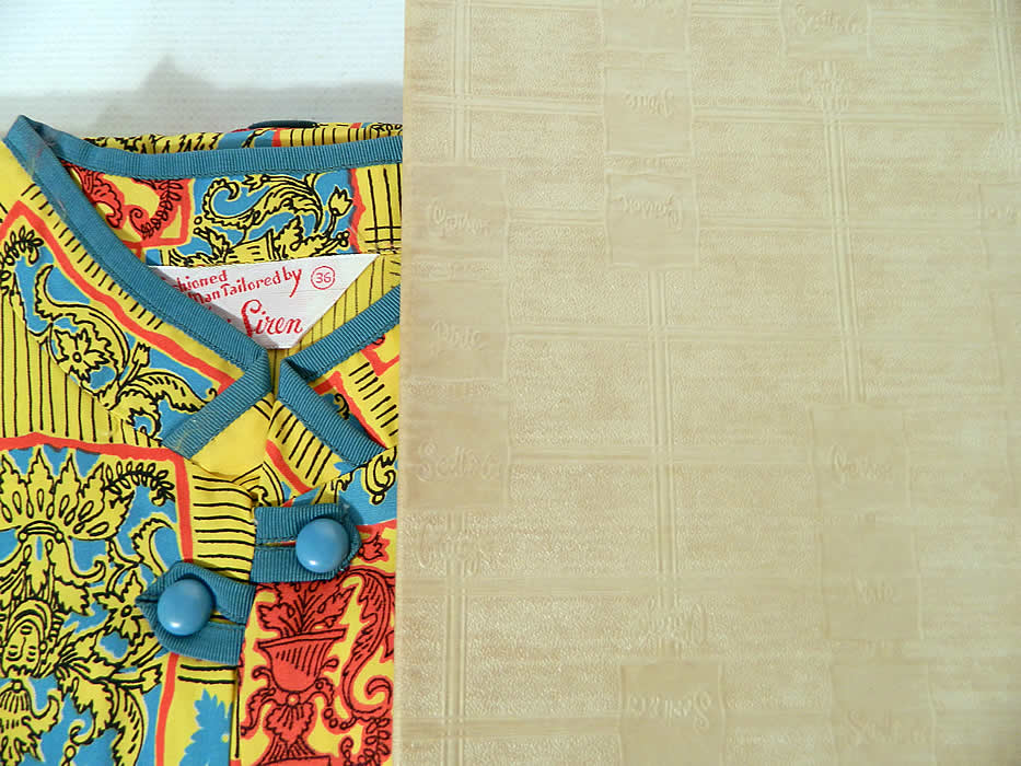 Deadstock Vintage Miss Siren Gothic Print Rayon Pajamas Lounge Set in Box. This pretty pajamas sleepwear set has a short sleeve shirt top, with a mandarin collar, breast pocket, turquoise blue plastic buttons and matching fabric pants.