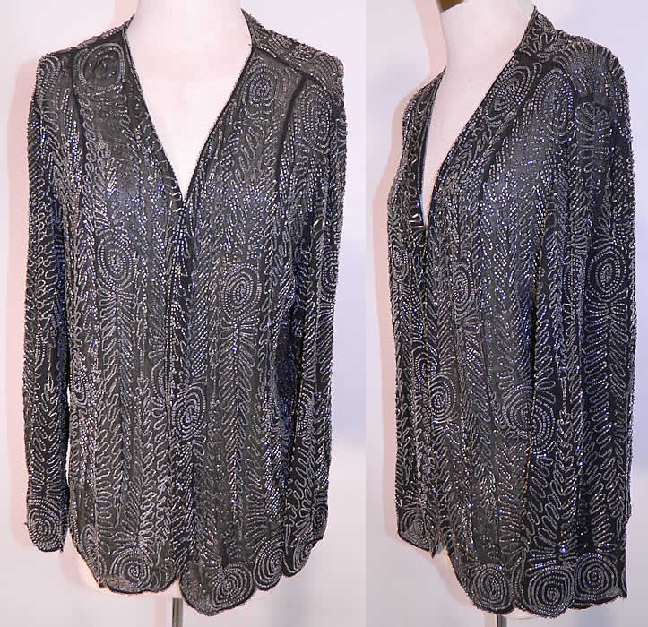 Vintage Art Deco Black Silk Chiffon Crystal Beaded Flapper Coat Jacket. It is made of a black sheer silk chiffon fabric, covered with crystal bead work done in a Art Deco abstract geometric spiral pattern beaded design. This exquisite evening coat flapper jacket is mid length, loose fitting, with long full sleeves, a scalloped bottom hemline, an open front with no closure and is sheer, unlined.