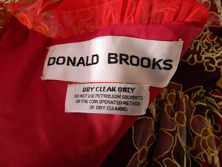 Vintage Donald Brooks Colorful Net Lace Flower Boho Maxi Dress Evening Gown label close up. It is fully lined, with a "Donald Brooks" designer label sewn inside.