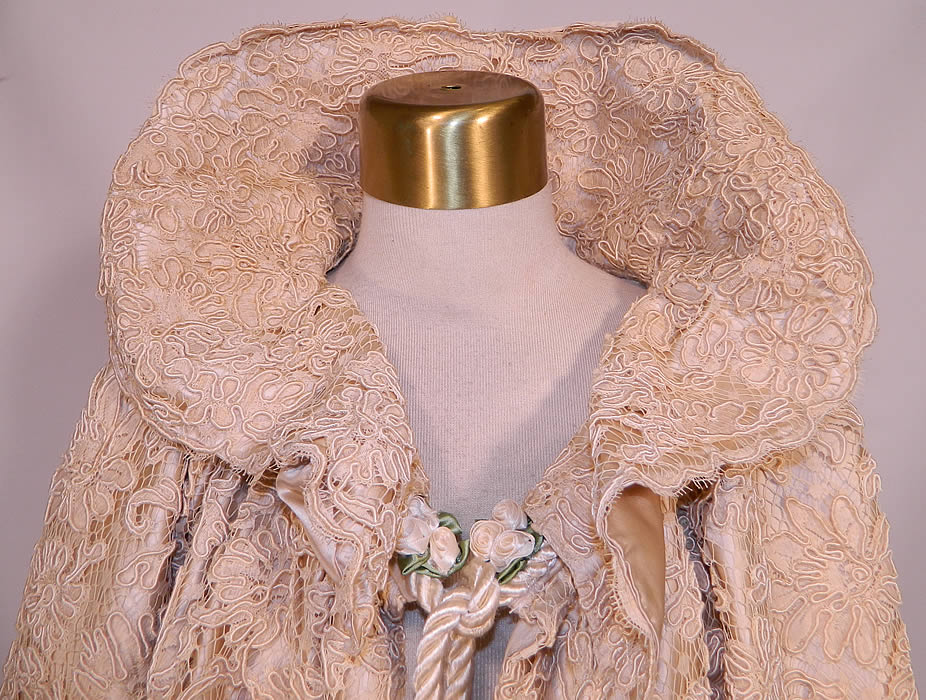Victorian Cream Silk Soutache Net Lace Wedding Cloak Cape. It is in good condition, with only a few faint small age spot stains and has been relined with added rope tie closure and rosette trim. 