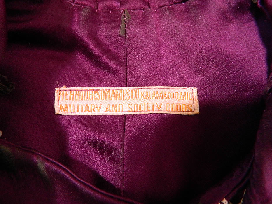 Vintage Henderson Ames Co Regalia Purple Silk Ceremonial Robe Gown label close up. There is a "Henderson Ames Co. Kalamazoo, Michigan Military And Society Goods" label sewn inside.
