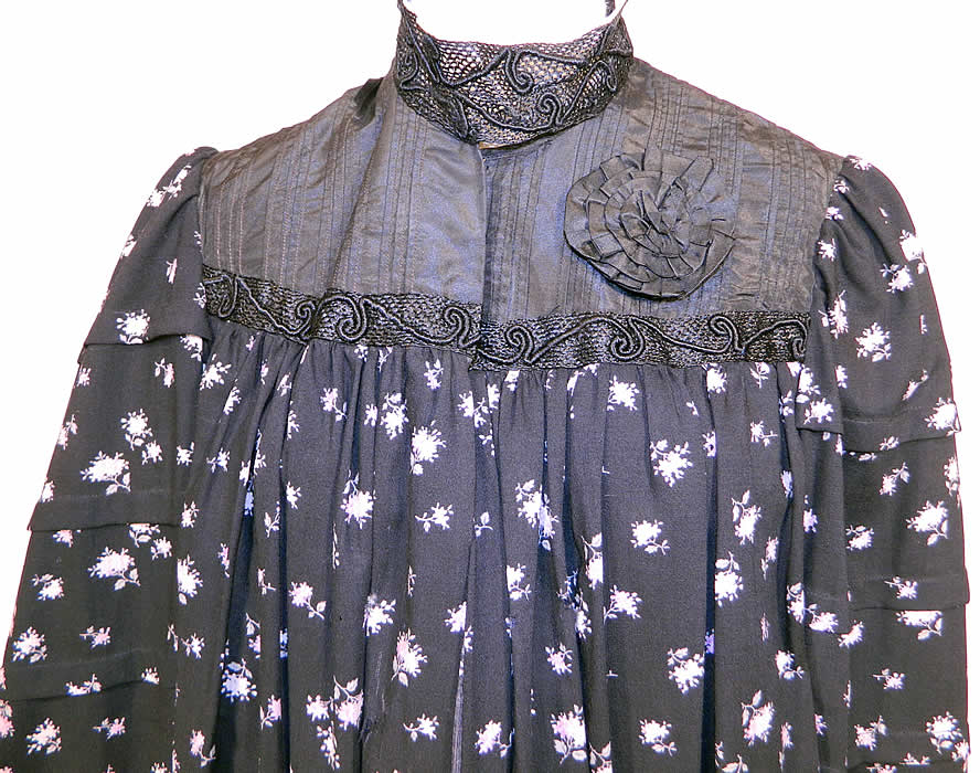 Victorian Black Wool Purple Lilac Floral Print Wrapper Morning Robe Dress Gown. This beautiful wrapper robe style morning dress gown is loose fitting, floor length, has a pleated back, with gathering on the mid back waist, a high collar neckline, gathered shoulders, long full sleeves and a black polished cotton inside camisole top lining with button closures.