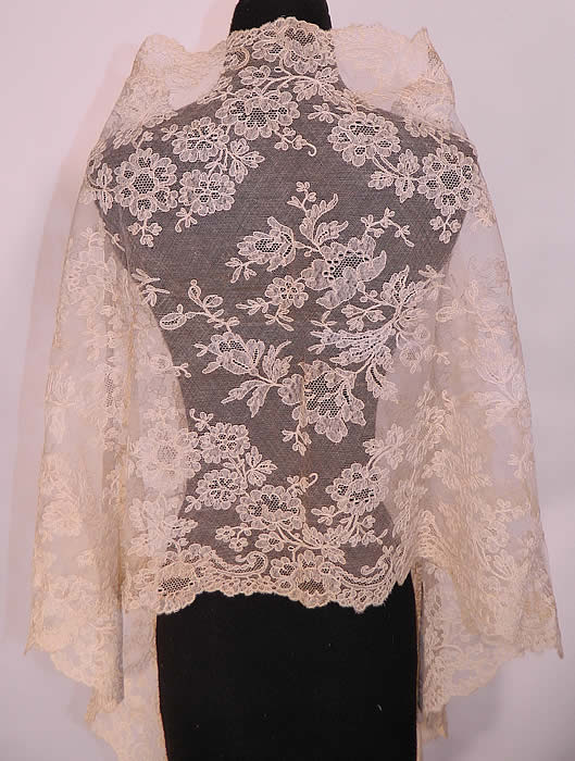 Victorian Antique Blonde Chantilly Bobbin Lace Mantilla Spanish Shawl Veil. This lovely lace has a intricately done lush floral design throughout. It has been created into a long rectangle shape shawl style scarf wrap veil Spanish mantilla, which the blonde color would have been appropriate for a church wedding or other ceremonial occasions. 
