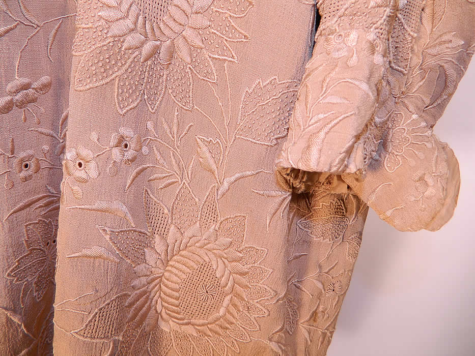 Vintage Art Deco Ecru Silk French Knot Embroidered Drawn Work Robe Coat. The coat measures 36 inches long, with 46 inch hips, a 44 inch waist, 40 inch bust, 17 inch back and 21 inch long sleeves.