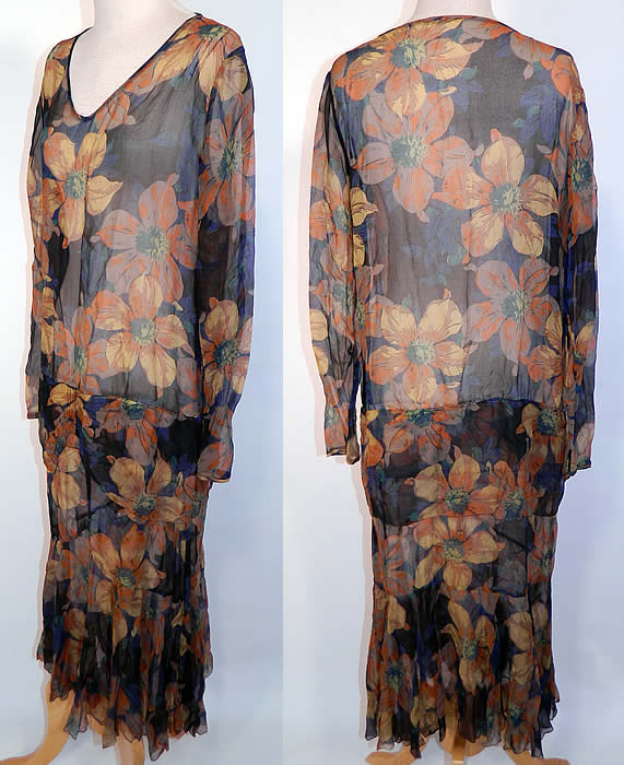 Vintage Black & Yellow Floral Poppy Print Silk Chiffon Drop Waist Dress. This fabulous flapper dress has a loose fitting drop waist style, with a V front neckline and long sleeves. It is sheer and unlined. The dress measures 48 inches long, with 36 inch hips, a 38 inch waist, 38 inch bust, 14 inch back and 24 inch long sleeves.