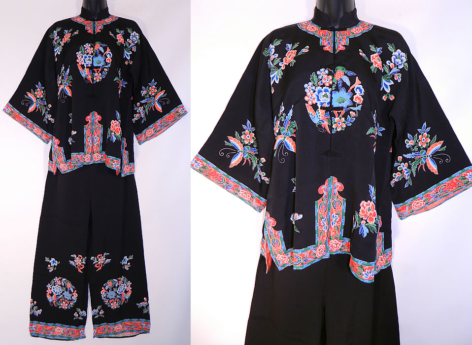 Vintage Chinese Black Silk Screen Floral Butterfly Pajama Lounge Set. Included in this two piece loose fitting lingerie lounging outfit pajamas set is a coat jacket robe style blouse top, with black silk knotted button toggle closures, a mandarin collar, 3/4 length long full sleeves with flared cuffs and is fully lined in a muted red rayon silk damask fabric.