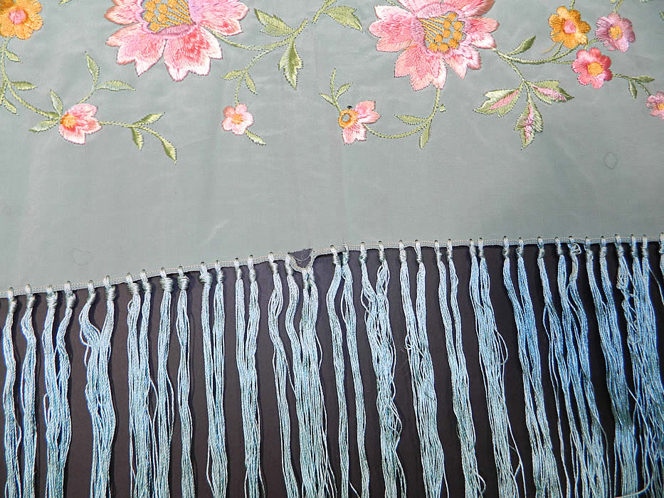 Antique Light Blue Silk Pink Floral Embroidered Fringe Boho Piano Shawl. It is in good condition, but has not been cleaned, with some small faint age spotting, water spots around the edging and a tiny fray near the fringe trim.