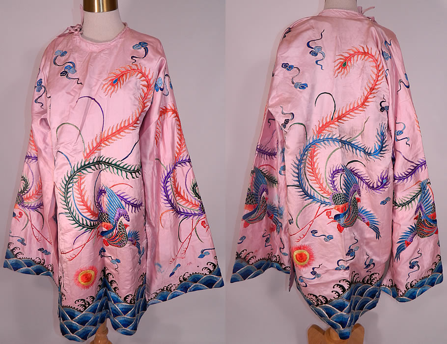 Antique Chinese Pink Silk Embroidered Phoenix Bird Opera Robe Coat. This antique Chinese pink silk embroidered phoenix bird opera robe coat dates from the early 1900s. It is made of a light pinkish purple lilac color silk fabric, with bright colorful raised padded satin stitch embroidery work outlined in silver metallic thread couching work.