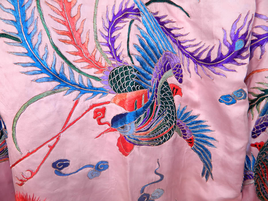 Antique Chinese Pink Silk Embroidered Phoenix Bird Opera Robe Coat. There are embroidered mythological phoenix birds, sun, smoke clouds and waves of water along the bottom. The phoenix is the symbol of strength, resilience, good fortune, opportunity and luck. It can also symbolize rebirth, renewal and the sun.