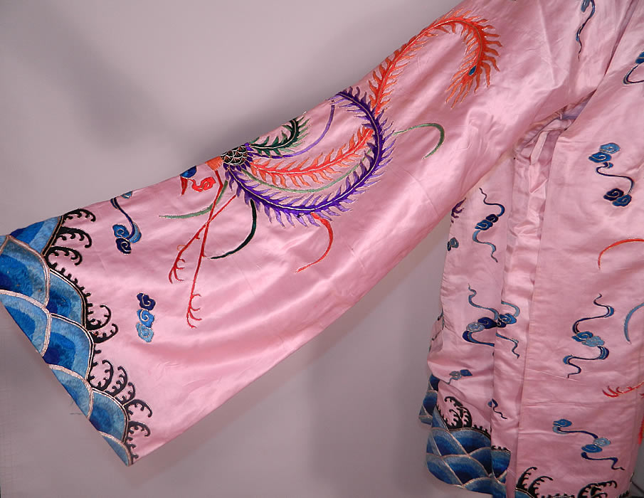 Antique Chinese Pink Silk Embroidered Phoenix Bird Opera Robe Coat. This antique Chinese pink silk embroidered phoenix bird opera robe coat dates from the early 1900s.