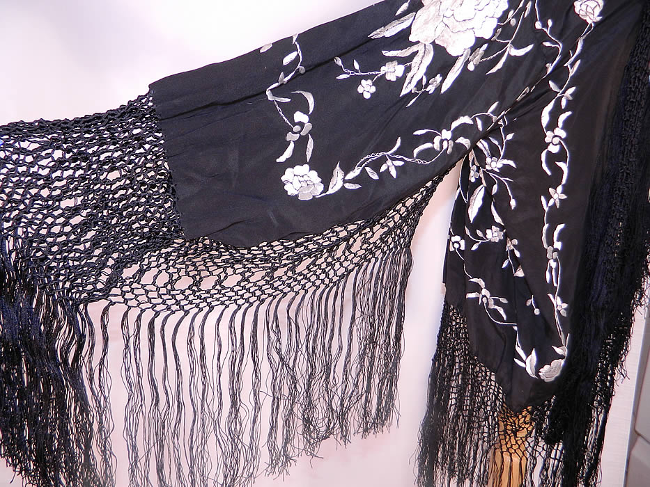 Vintage Black & White Silk Floral Embroidered Piano Shawl Fringe Robe Coat. There is black silk hand knotted macram&eacute; silk fringe trim edging measuring 15 inches long. 