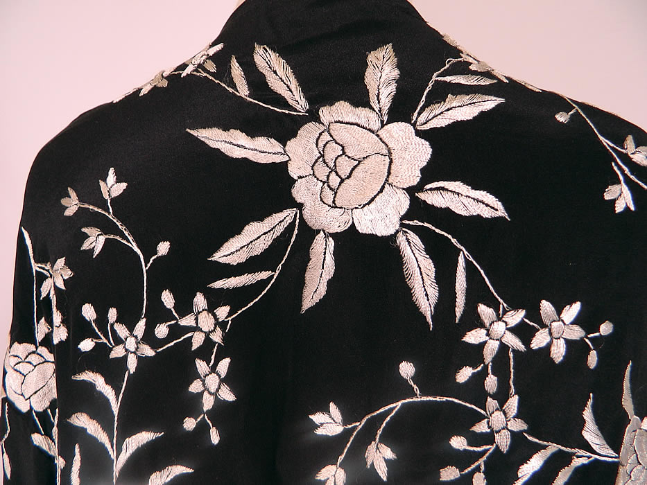 Vintage Black & White Silk Floral Embroidered Piano Shawl Fringe Robe Coat. This lovely loose fitting kimono robe style coat is a long mid length, with an open front, no closure, with long full sleeves and is unlined.