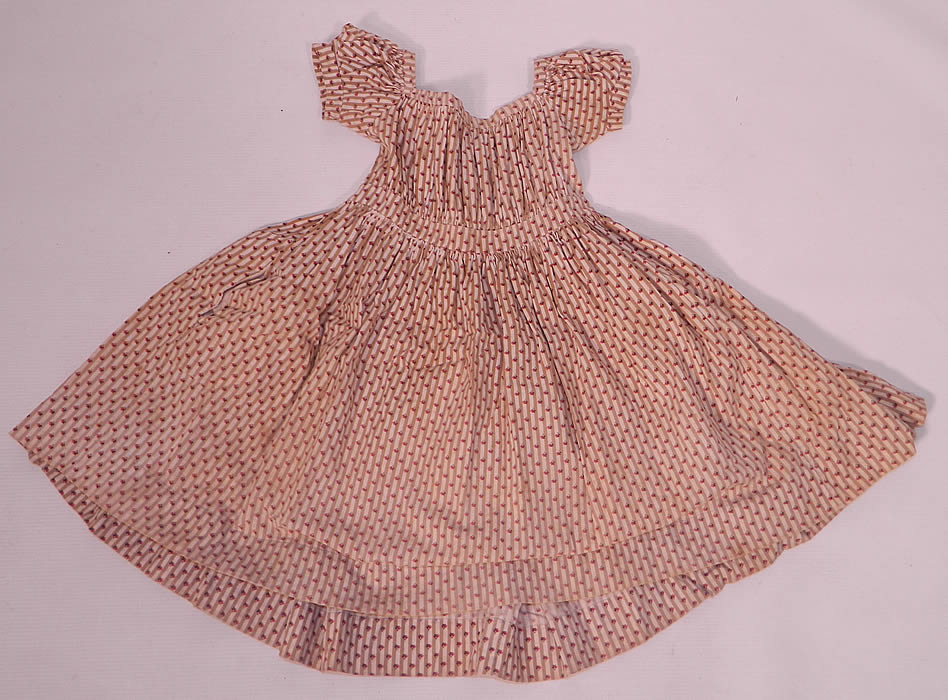 Victorian Childs Chintz Calico Cotton Stripe Print Girls Dress. This charming child's little girls dress has a squared scoop neckline, short puffy cap sleeves, a fitted high empire waist with gathers and a full skirt with side pocket.