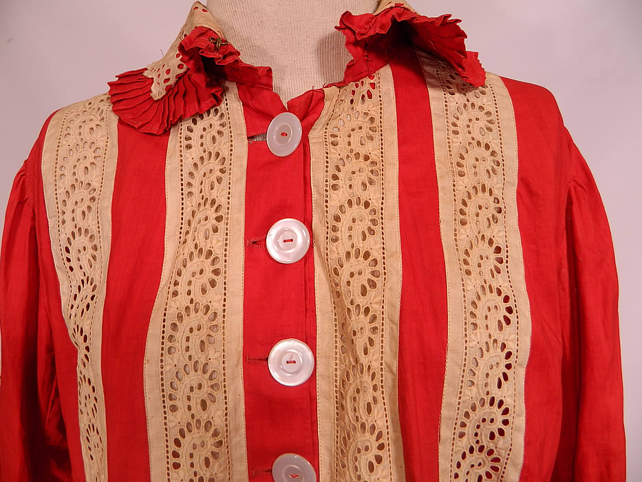 Victorian Maternity Red Cotton Cream Lace Bustle Gown Dress. This magnificent 2 piece maternity dress has a loose fitting long bodice tunic top, with ruffle skirted bottom, collar, long sleeves with rolled cuffs, an adjustable red silk ribbon tie back sash and mother of pearl buttons down the front for closure. The bodice is unlined, measures 35 inches long, with 50 inch hips, a 36 inch waist, 42 inch bust, 13 inch back and 23 inch long sleeves. 