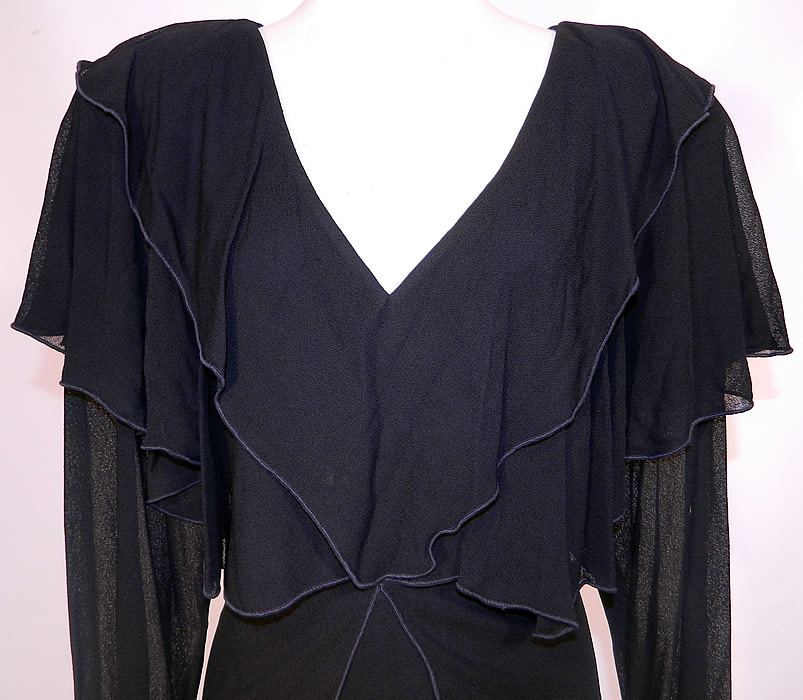 Vintage Holly Harp Layered Crepe Georgette Black Cocktail Dress. The dress measures 40 inches long, with 36 inch hips, a 32 inch waist, 36 inch bust, 18 inch back and 25 inch long sleeves. It is in good condition. This is truly a wonderful piece of quality made designer wearable art!