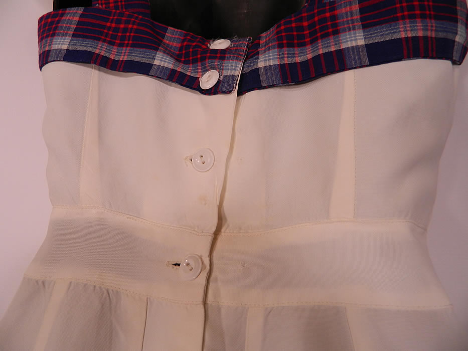 Vintage White Rayon Plaid Playsuit Shorts Skirt Bolero Jacket Coverup Outfit. There is a short crop top bolero jacket, with a plaid trim lapel, short cap sleeves and open front with no closure. The jacket measures 14 inches long, with a 30 inch waist and 34 inch bust. It is in good condition, but has not been cleaned and has some faint age spot stains the back bottom shorts and jacket. This is truly a rare and wonderful piece of WWII era wearable art! 