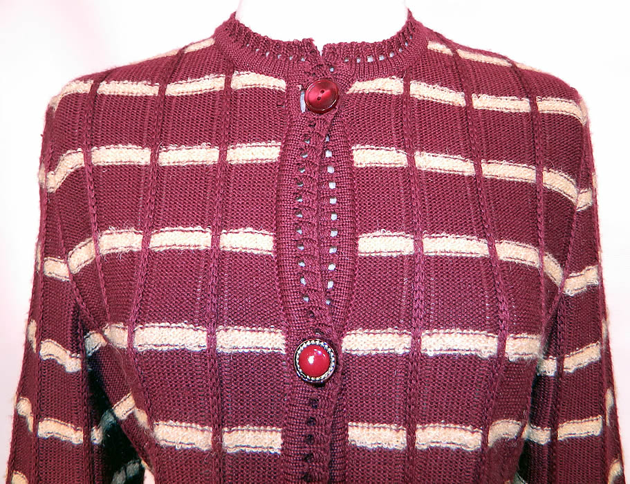 Vintage Burgundy Striped Knit Sweater Skirt Set Outfit Dress. This wonderful winter knit two piece ensemble has a cardigan sweater top with decorative button closure front, eyelet crochet knit trim edging, long sleeves and is unlined.