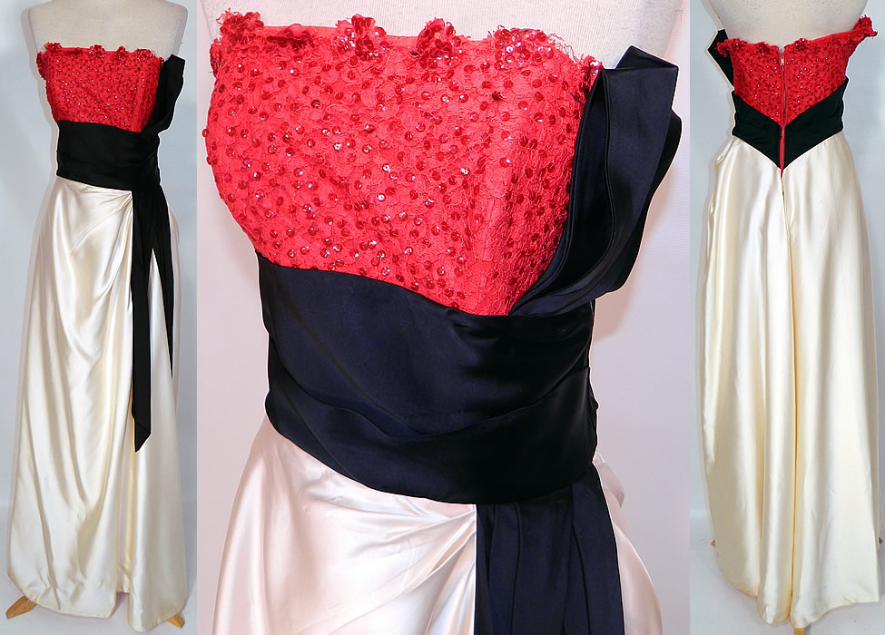 Vintage Emma Domb Red Lace Sequin Black & White Satin Strapless Evening Gown. This vintage Emma Domb red lace sequin black and white satin strapless evening gown dates from the 1950s. It is made of a red lace sequin top, with a white satin skirt and black satin trim waistband. This elegant evening gown is a long floor length, strapless, with a side drape skirt, cummerbund sash style waist trim, back zipper closure and is fully lined with stays boning sewn inside.