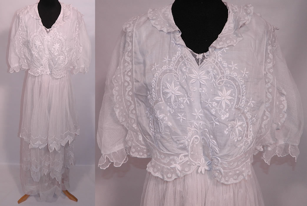 Edwardian Titanic Embroidered White Batiste  Net Lace Tiered Dress. This exquisite vintage Edwardian Titanic era embroidered white batiste net lace tiered dress dates from 1912. It is made of a fine white cotton batiste fabric top, with raised padded satin stitch embroidery work and valenciennes bobbin lace inserts, with a sheer white net skirt and sleeves.
