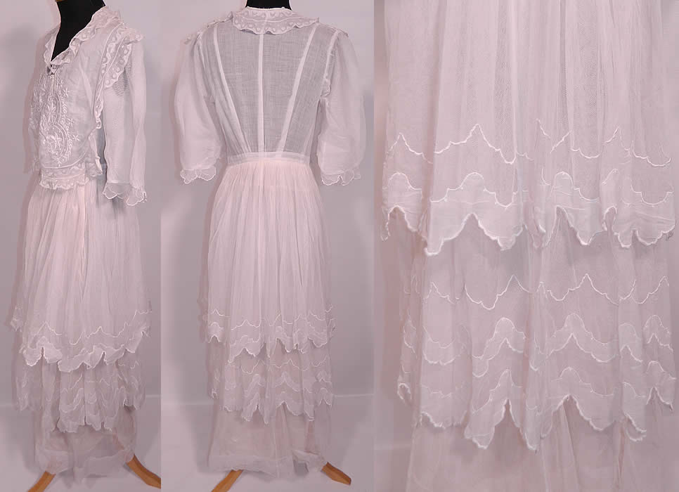 Edwardian Titanic Embroidered White Batiste  Net Lace Tiered Dress. The dress measures 45 inches long, with 34 inch hips, a 24 inch waist and 34 inch bust. It is in excellent condition. This is truly a wonderful piece of wearable lace art! 