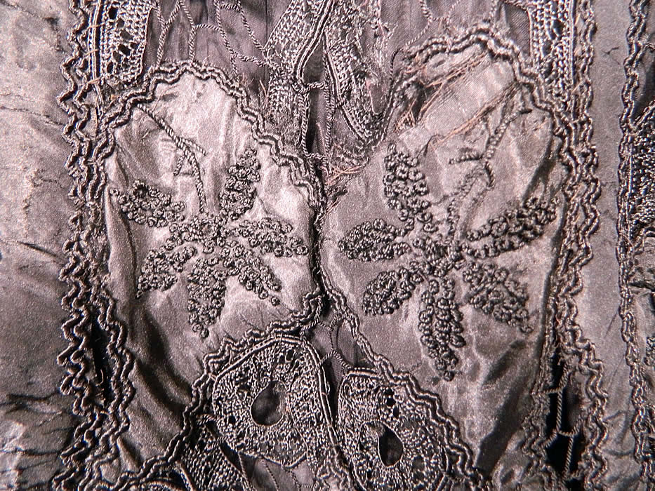Victorian Fuchs & Rosenberger Berlin Black Silk French Knot Battenburg Tape Lace  Coat. It is in good as-is condition, with some breaks in the connecting bars lace and several small splits frays in the silk fabric.