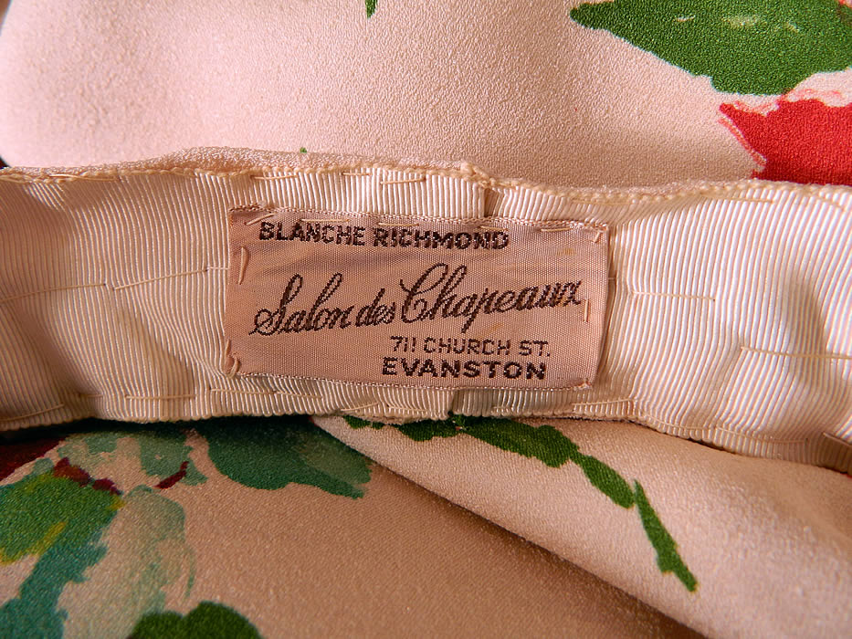 Vintage Red Roses Silk Crepe Bias Cut Belted Dress & Hat. Included is a matching fabric diadem open crown hat with a rolled bumper brim and "Blanche Richmond Salon des Chapeaux 711 Church St. Evanston" label sewn inside. The hat measures 21 inches in circumference. It is in good condition, with only a few faint small stains on the skirt. This is truly a wonderful piece of wearable art!