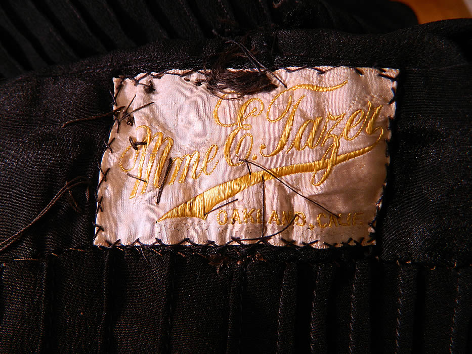 Vintage Flapper Black Silk Gold Violet Floral Embroidered Trim Drop Waist Dress. There is a "Mme E. Tazer Oakland, California" label sewn inside. 