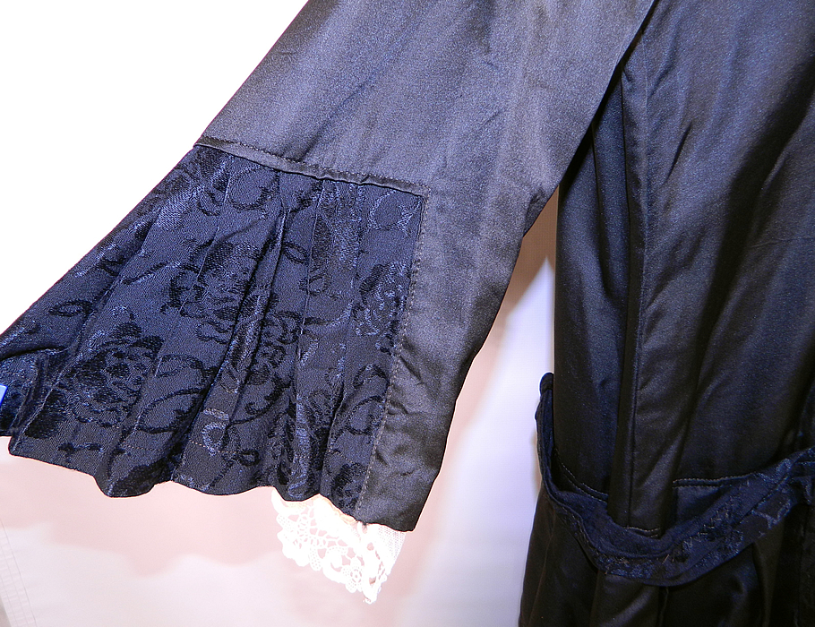 Vintage Gatsby Black Silk Floral Roses Brocade Damask Drop Waist Dress. The dress measures 50 inches long, with 40 inch hips, a 38 inch waist, 38 inch bust, 14 inch back and 19 inch long sleeves.