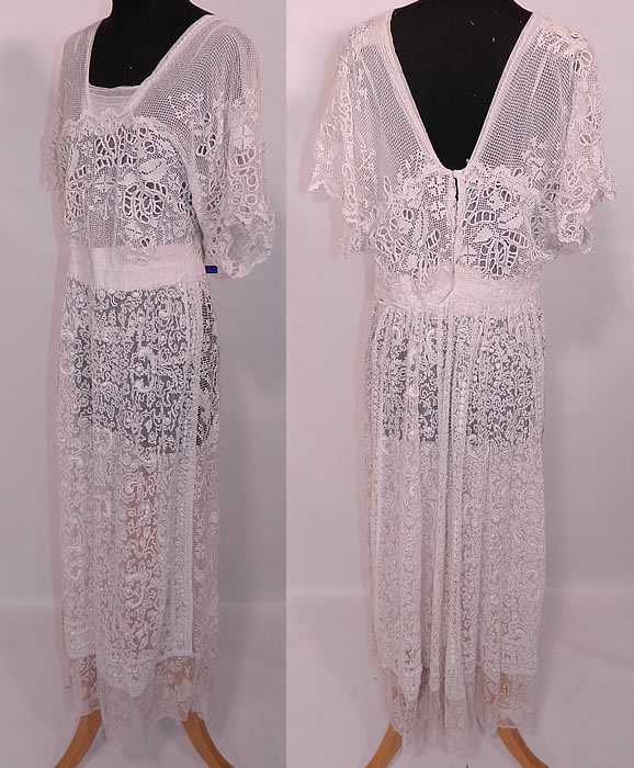 Edwardian White Net Embroidered Soutache Crochet Filet Lace Dress. There are crochet filet lace and drawn cut work detail accents. This lovely lace dress is a long tea length, with a layered squared neckline, flared dolman style short sleeves, a fitted waistband and is fully lined in a white cotton sheer net fabric with hook closures on the back.