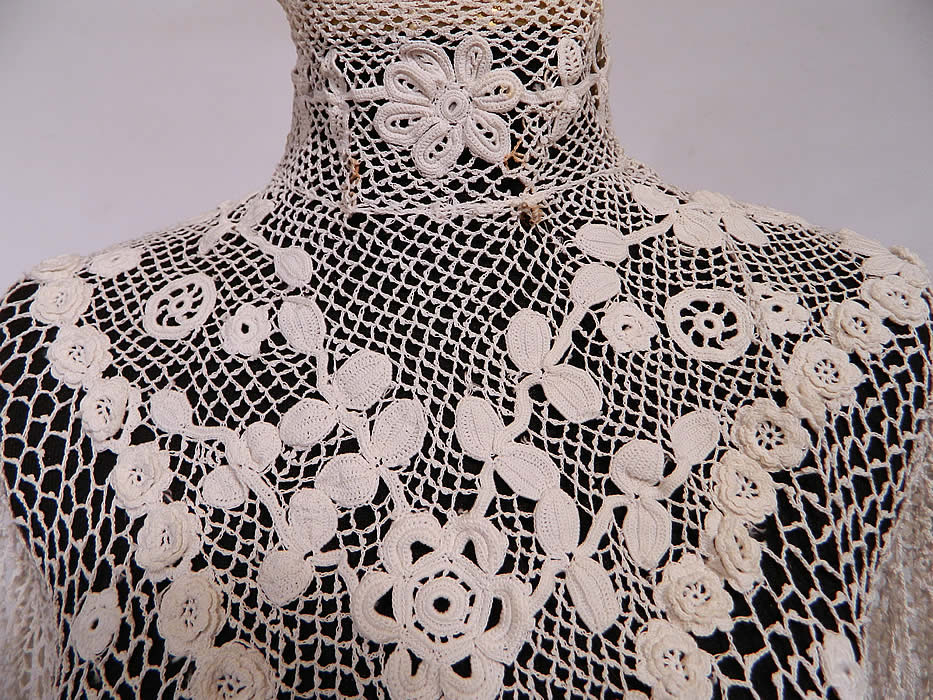 Edwardian Antique White Irish Crochet Tape Lace Bodice Blouse. It is sheer and unlined. The blouse measures 20 inches long, with a 34 inch waist, 34 inch bust, 12 inch back and 18 inch long sleeves.