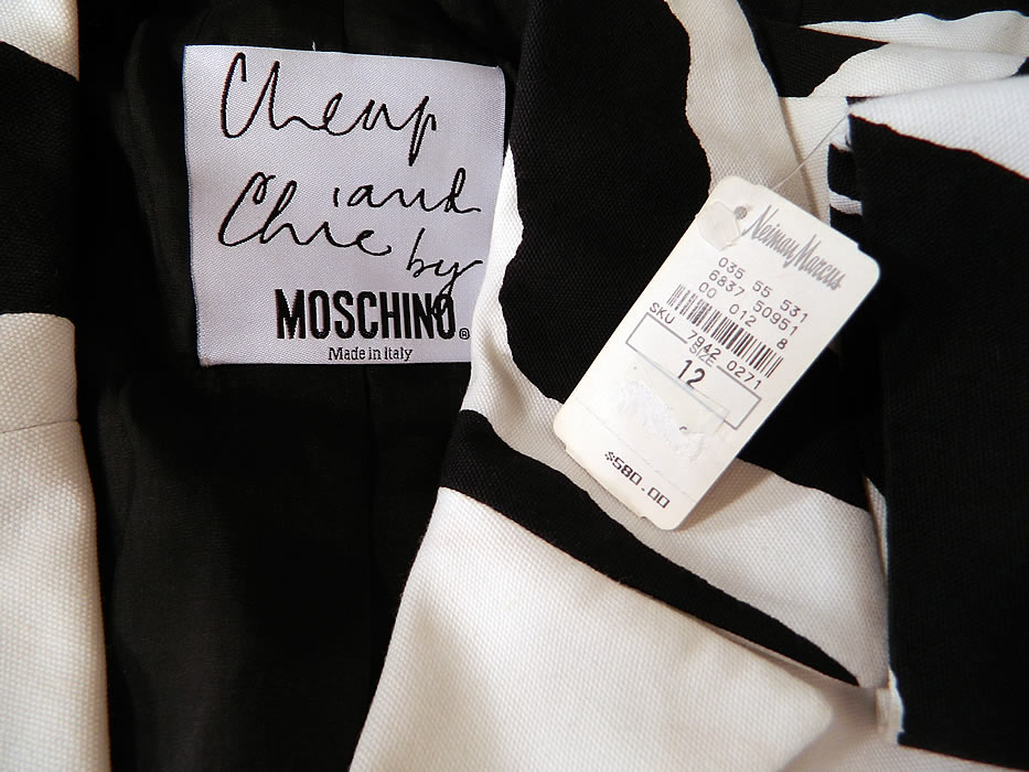 Vintage Cheap & Chic Moschino Black & White Zebra Print Suit Jacket Skirt. The skirt measures 16 inches long, with 38 inch hips and a 30 inch waist. It is in excellent unworn condition and still has the original Neiman Marcus department store price tag of $580.00 on the jacket.