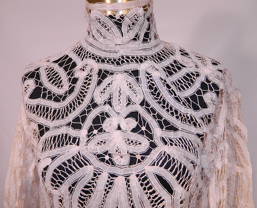 Victorian Antique  Cream Battenburg Tape Lace High Neck Collar Blouse Top. This lovely lace beautiful blouse top has a fitted high neck collar, long tapered sleeves with fitted cuffs, a skirted waist which comes to a point in the front, hook closures down the back and is sheer, unlined. 