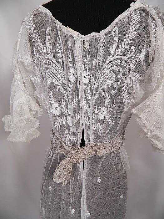 Edwardian White Net Tambour Embroidery Lace Silver Rosette Belted  Dress. It is in good condition, with several tiny holes in the net fabric top and some missing hook closures on the back. This is truly an exceptional piece of antique lace textile art which could be worn as a wedding gown or graduation dress!