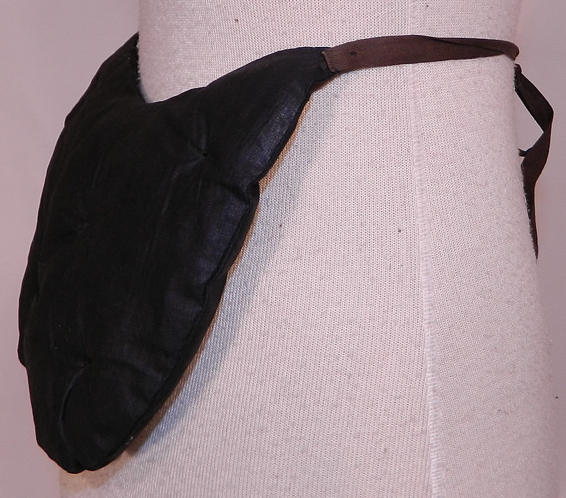Victorian Quilted Horse Hair Black Polished Cotton Crinolette Bustle Pad Support. This antique Victorian era quilted horse hair black polished cotton crinolette bustle pad support dates from 1880. The bustle pad measures 7  by 8 inches. It is in good  condition. This is a rare and wonderful piece of wearable Victoriana art!  