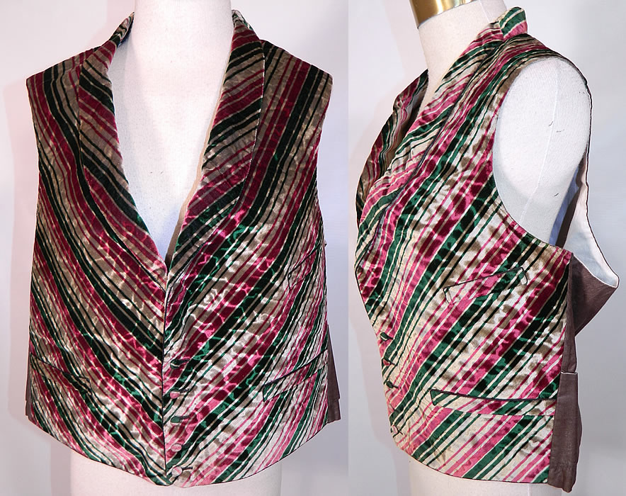 Victorian Men's Silk Velvet Striped Candy Cane Dickens Holiday Waistcoat Vest. This antique Victorian era men's silk velvet striped candy cane Dickens holiday waistcoat vest dates from the 1850s. It is hand stitched and made of a unique textured wavy watered silk velvet fabric with a colorful red, green and beige striped candy cane design pattern.