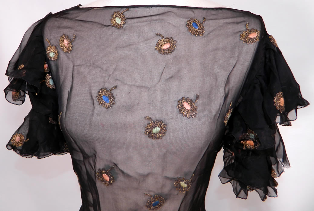 Vintage Gold Lamé Embroidered Black Silk Chiffon Bias Cut Evening Gown Dress. This beautiful bias cut long floor length evening gown, has layered ruffle short sleeves, no side opening closures and is sheer, unlined.