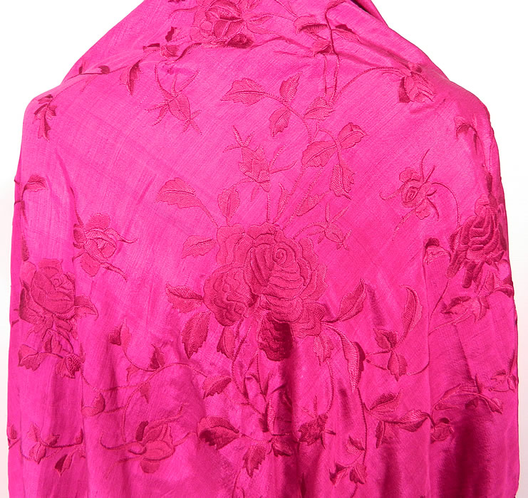 Vintage Fuchsia Purple Silk Floral Embroidered Fringe Boho Piano Shawl. There is fuchsia hand knotted macramé fine silk fringe which measures 16 inches long surrounding the entire shawl.