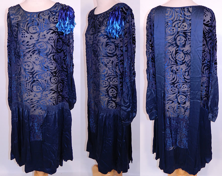 Art Deco Vintage Blue Silk Burnout Voided Velvet Drop Waist Flapper Dress. This vintage Art Deco blue silk burnout voided velvet drop waist flapper dress dates from the 1920s. It is made of a unique textured sheer navy blue color silk chiffon and burnout voided cut velvet fabric, with an Art Deco abstract swirling polka dot design pattern.
