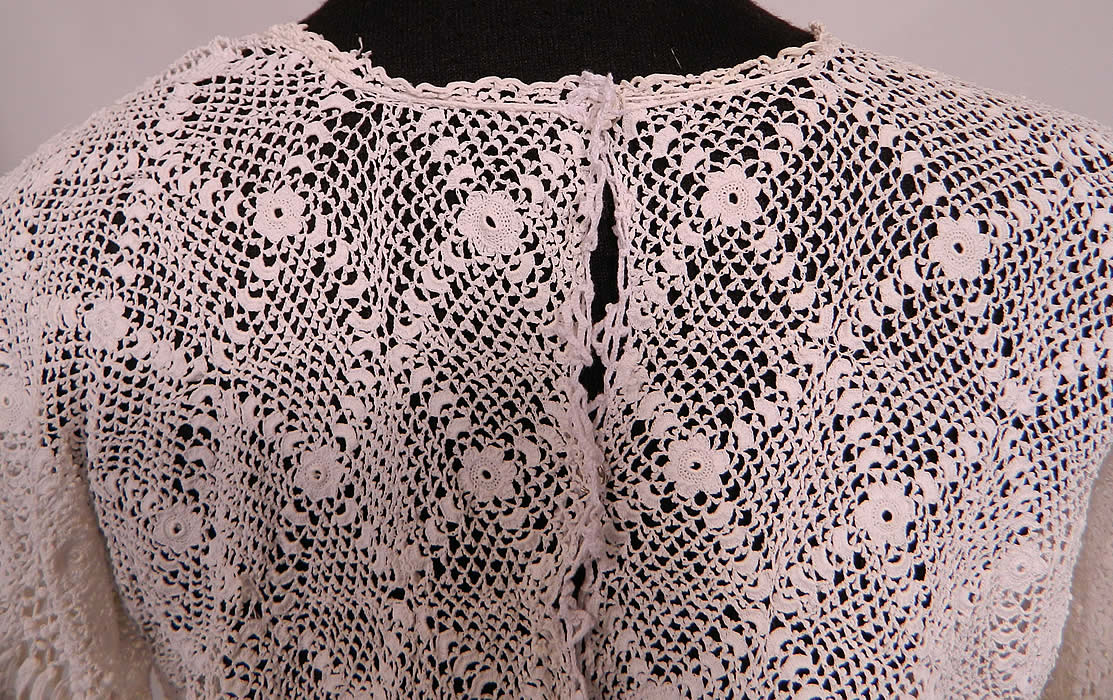 Edwardian Antique White Irish Crochet Tape Lace Shirt Bodice Blouse.  The blouse measures 15 inches long, with a 34 inch waist, 34 inch bust, 15 inch back and 17 inch long sleeves. It is in good condition. This is truly a extraordinary piece of wearable antique lace art!