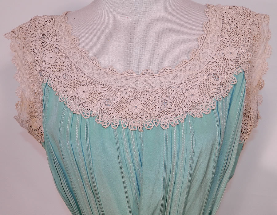 Vintage Aqua Pleated Silk Irish Crochet Lace Belted Chemise Shift Slip Dress. This lovely lace loose fitting chemise style straight shift slip dress has a matching silk fabric tie sash belt, with lace trim yoke neckline and is sleeveless.