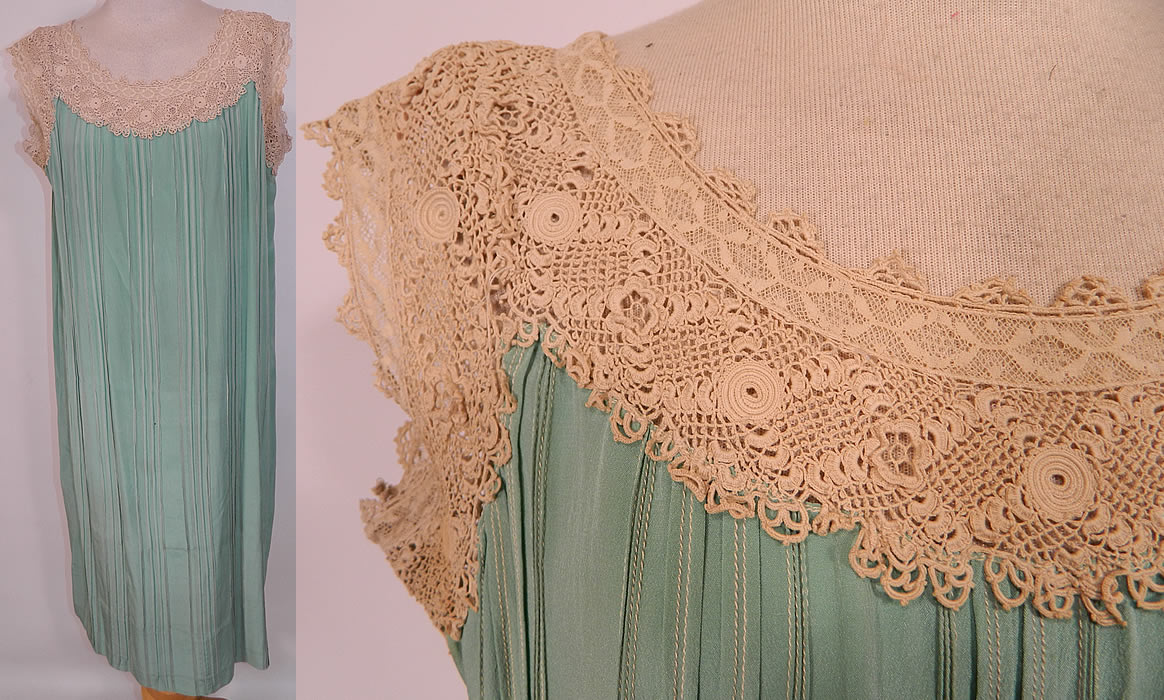 Vintage Aqua Pleated Silk Irish Crochet Lace Belted Chemise Shift Slip Dress. The dress measures 38 inches long, with 44 inch hips, a 42 inch waist and 40 inch bust. It is in good wearable condition. This is truly a wonderful piece of wearable art! 