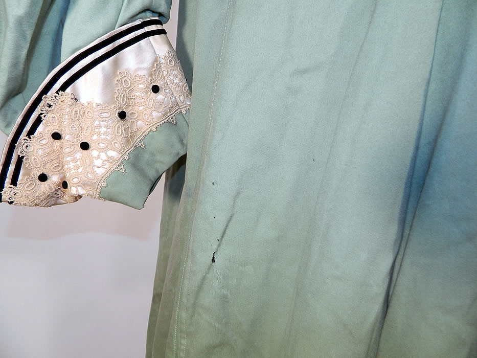 Edwardian Mint Green Wool Black Velvet White Lace Trim Winter Traveling Coat.  It is in as-is fair condition, has not been cleaned, with some slight fade, discoloration and several areas of small moth nips and holes (see close-ups). This is truly a beautiful piece of wearable antique textile art! 