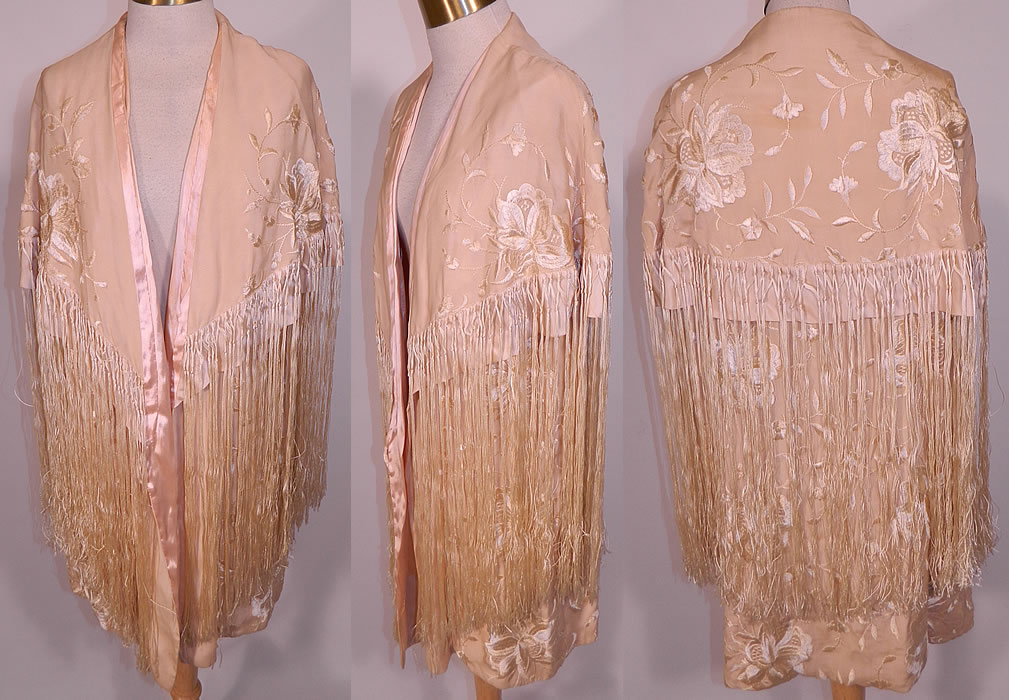 Vintage Cream Silk Floral Embroidered Fringed Piano Shawl Coat Cloak Cape. This vintage cream silk floral embroidered fringed piano shawl coat cloak cape dates from the 1920s. It is made of an off white cream color silk fabric, with cream silk raised padded satin stitch embroidered vine leaf flowers design.