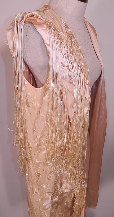 Vintage Cream Silk Floral Embroidered Fringed Piano Shawl  Coat Cloak Cape. The cape measures 42 inches long, with a 40 inch bust and waist. It is in good condition. This is truly a wonderful piece of wearable  textile art! 