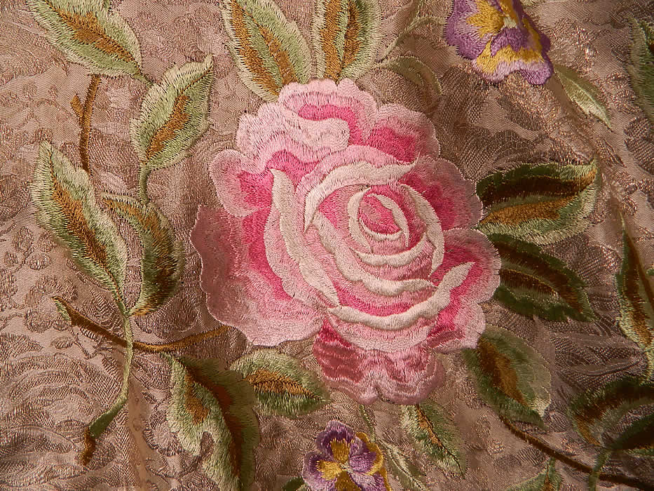 Vintage Embroidered Pink Roses Purple Pansies Silver Lame Lamé Cream Silk Shawl. There are silk raised padded satin stitch pink roses and purple pansy flowers vine leaf designs embroidered across the center.