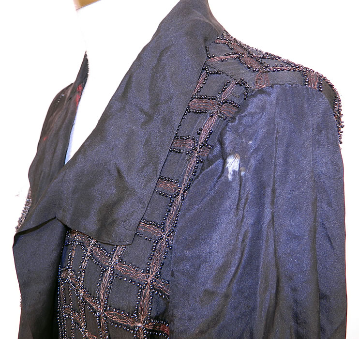 Vintage Art Deco Black Silk Gold Lamé Beaded Grid Evening Flapper Coat Jacket. It is in as-is fair condition, with  some staining, tarnish discoloration under the arms and in areas, with several tiny pin holes scattered throughout and a few small frayed holes on the shoulder (see close-up). This is truly a wonderful piece of wearable Art Deco textile art which would be great for design! 