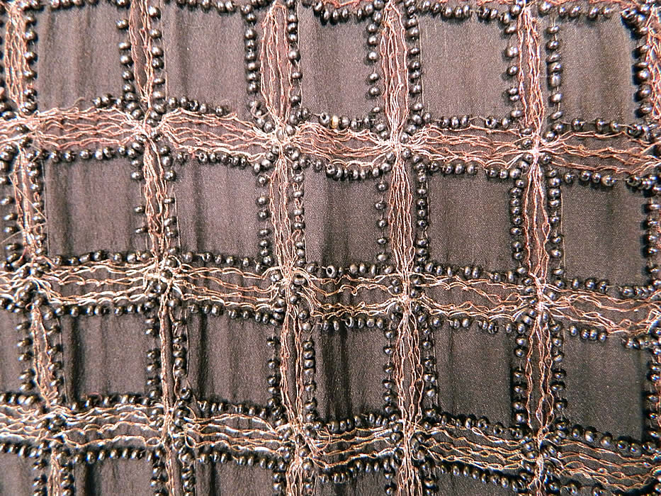 Vintage Art Deco Black Silk Gold Lamé Beaded Grid Evening Flapper Coat Jacket. The coat measures 44 inches long, with 40 inch hips, a 36 inch waist, 40 inch bust, 16 inch back and 24 inch long sleeves. 