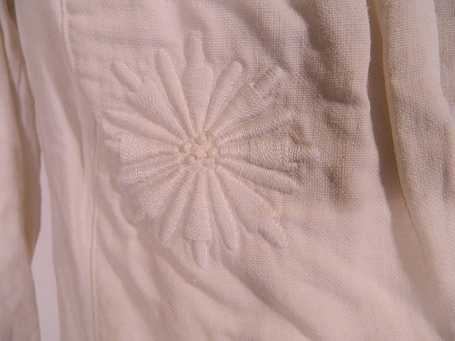Edwardian White Linen Soutache Embroidery Work Walking Suit Jacket & Skirt. This stunning summer two piece walking suit includes a fitted tailored suit jacket, with an embroidered fold over collar, single crochet covered button closure, long sleeves and is unlined. The jacket measures 26 inches long, with 42 inch hips, a 40 inch waist, 38 inch bust, 13 inch back and 20 inch long sleeves.