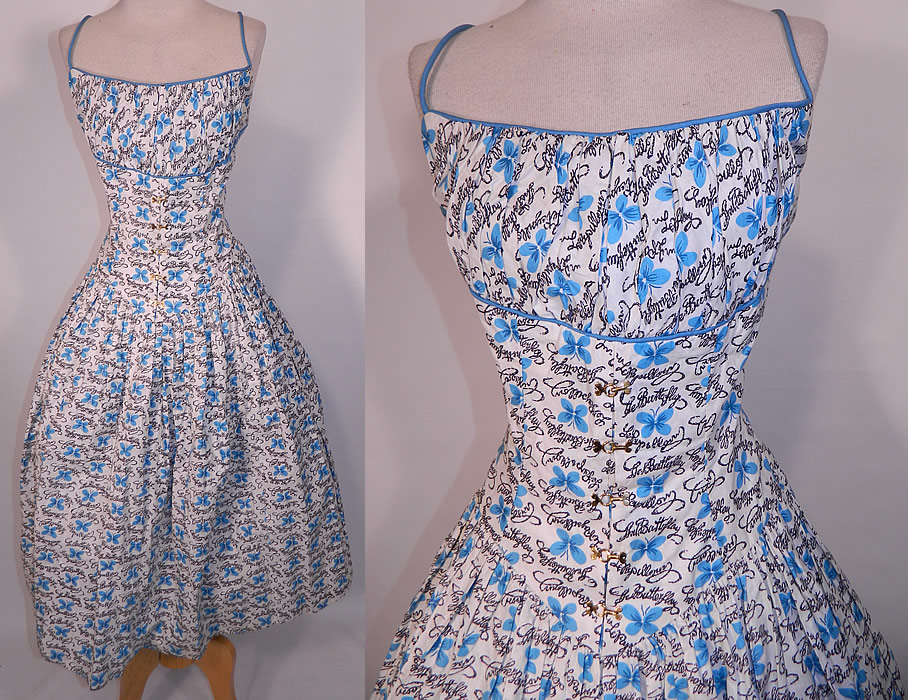 Vintage Blue Butterfly Papillon Print Cotton Circle Skirt Summer Sun Dress. This vintage blue butterfly papillon print cotton circle skirt summer sun dress dates from the 1950s. It is made of a white cotton fabric, with blue butterflies and black hand writing of the English word "Butterfly" & French "Papillon" novelty print designs.