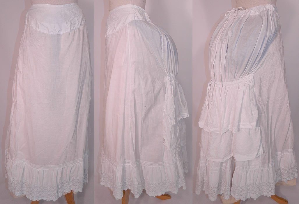 Victorian White Cotton Eyelet Lace Gathered Ruffle Bustle Back Petticoat Skirt. This antique Victorian era white cotton eyelet lace gathered ruffle bustle back petticoat skirt dates from the 1880s. It is made of a white cotton fabric, with pleating, gathering on the back and an embroidered eyelet scalloped bottom ruffle hemline.